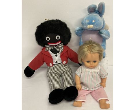 A vintage Tiny Tears vinyl doll in original clothes.  Together with a large soft toy golly by Valentina with original tag and