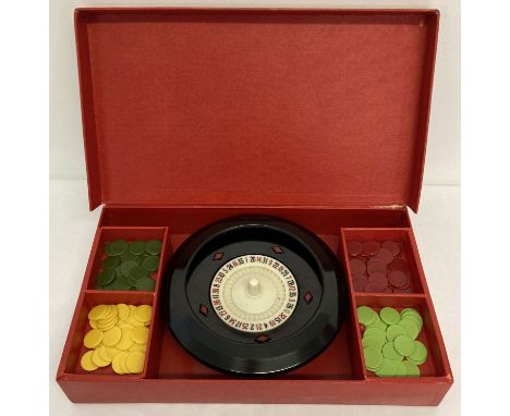 A vintage K &amp; C Ltd, London, boxed roulette wheel and playing counters.  