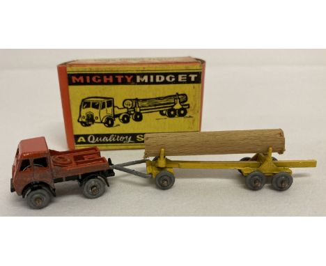 A boxed 1950's Benbros Mighty Midget No 8 Foden Timber Tractor (type 2).  Orange/red tractor with yellow trailer, unpainted m