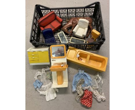 A collection of vintage 1970's Sindy furniture and clothes in play worn condition.  To include yellow bath, sink unit and toi