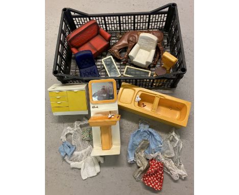 A collection of vintage 1970's Sindy furniture and clothes in play worn condition.  To include yellow bath, sink unit and toi