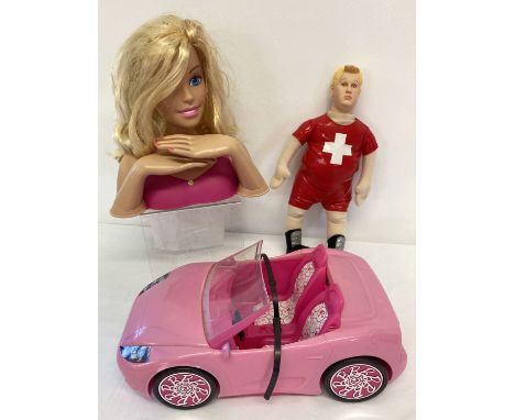 A Little Britain David talking plush doll together with 2 Mattel Barbie toys.  Hair style Barbie head and 2010 pink sports ca