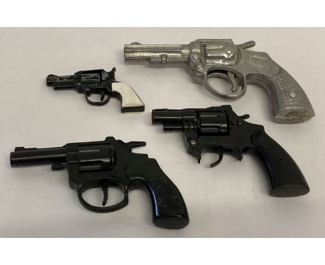 A collection of 4 vintage plastic and metal toy guns.  Comprising: Lone Star "Gambler" spud gun, Fairylite cast metal cap gun