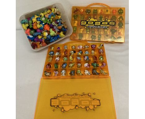 A collection of 220+ vintage Gogo's Crazy Bones figures and 2 carry cases.  Lot includes felt and shiny figures. 