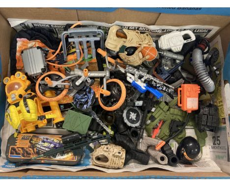 A box of modern Action Man weapons and accessories.  To include: helmets, boots, body vests and a cycle. 