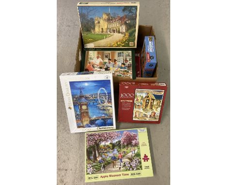 A box of vintage and modern puzzles. To include Waddington's, Hop and Otter House.  