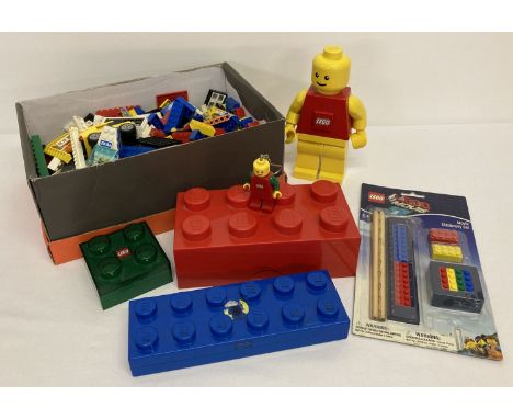 A collection of loose Lego and Lego merchandise.  To include: Lego man torch, key ring torch, brick light, pencil case, stora