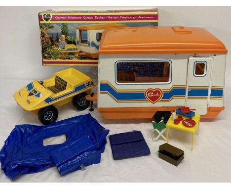 A boxed 1970's Sindy caravan by Pedigree, No 44579.  Together with a 1970's Sindy buggy (a/f) , tent, blow up bed and camping