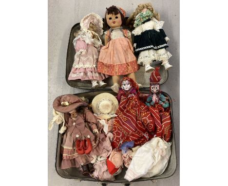 A case containing vintage and modern porcelain dolls, ethnic cloth dolls and a quantity of dolls clothes and accessories to i
