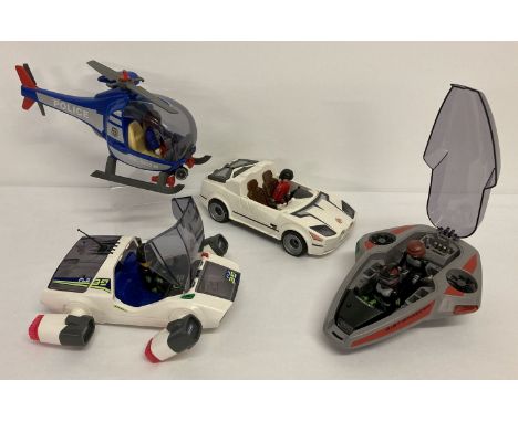 4 playmobile vehicles with a selection of figures to include a helicopter and futuristic vehicles.  