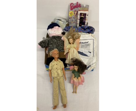 A box of vintage dolls clothes, to include knitted, together with a vintage Dusty doll.  And flower fairy dolls. 