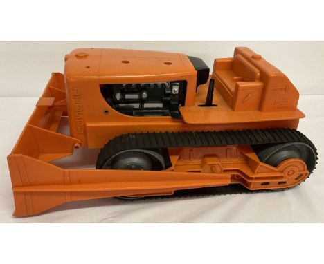 A vintage Marx Toys battery operated Marx-a-Power Giant Bulldozer.  With metal base, rubber tracks and plastic body. Lever ac