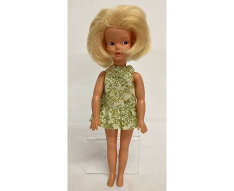 An early 1970's Patch Doll with blonde hair in a green floral mini dress by Pedigree.  No. 047001 to her back, 'Made in Engla