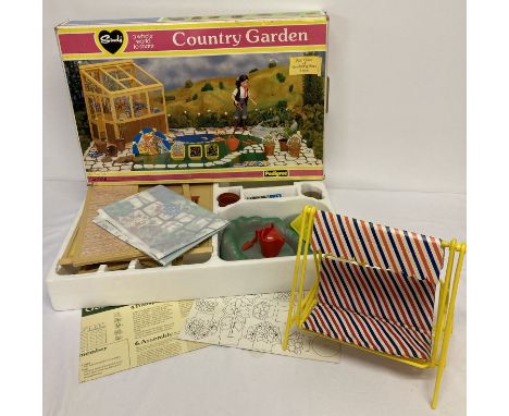 A 1970's Sindy boxed County Garden set by Pedigree No.44389. Together with a unboxed garden swing.  Country Garden set contai