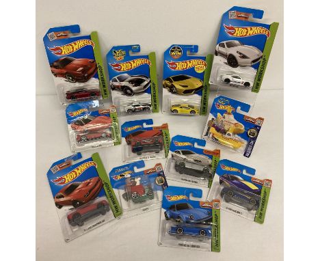 12 Hot Wheels 1:72 scale diecast  vehicles. All still sealed in original packaging.  To include: HW Workshop No. 197, 205, 21