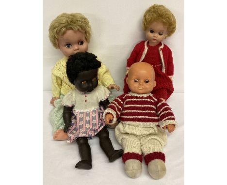 4 vintage vinyl dolls in varying sizes. A Fisher Price "Cherry" soft body doll with vinyl head.  Together with a black 16" vi