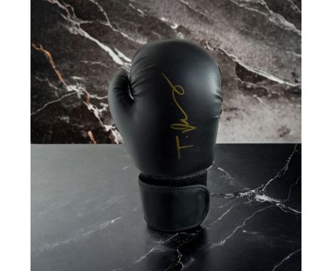 Tyson Fury signed black boxing glove. Tyson Luke Fury (born 12 August 1988) is a British professional boxer. He has held the 