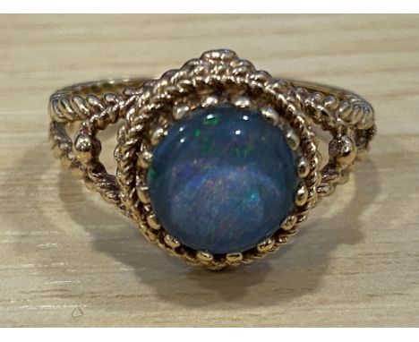 A 9ct yellow gold and opal ring, in claw setting, 3.2g gross, size L.