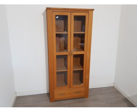 Solid light Oak 4 tier bookcase with glazed doors, also fitted with a single drawer 90x191cm