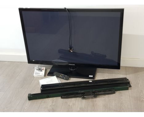 Samsung 43" plasma TV on stand with remote and wall bracket