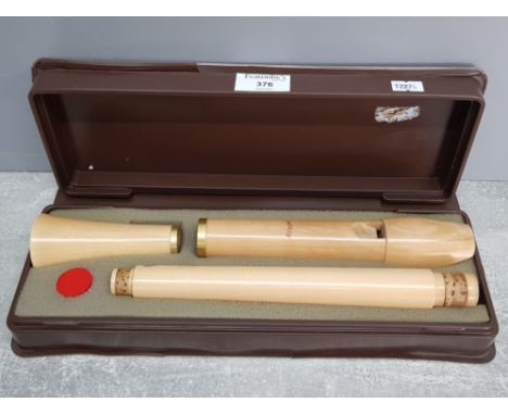 A Moeck three piece treble recorder in fitted case.