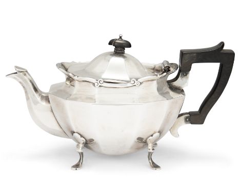 An Edwardian silver teapotGoldsmiths & Silversmiths Co.London, 1908With ebonised handle and finial, on four outswept feet, 12