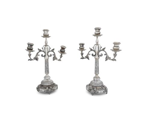 A pair of Turkish three light candelabraStamped 90020th centuryDesigned with foliate scrolling branches to baluster shaped ca