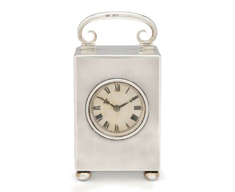 A George V silver carriage clockGoldsmiths & Silversmiths Co.London, 1919The rectangular, engine-turned case raised on four b