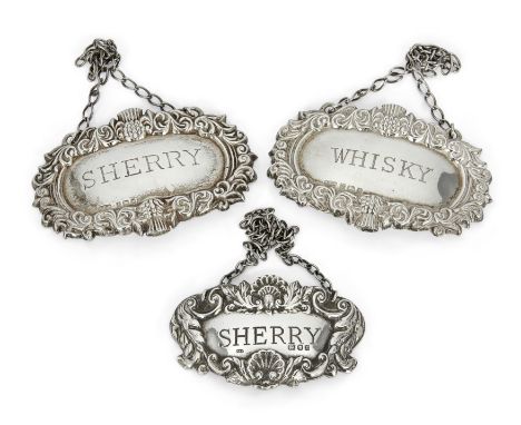 A pair of silver decanter labels with thistle bordersR. E. PorterBirmingham, 1984 and 1986One label reading 'Whisky', the oth