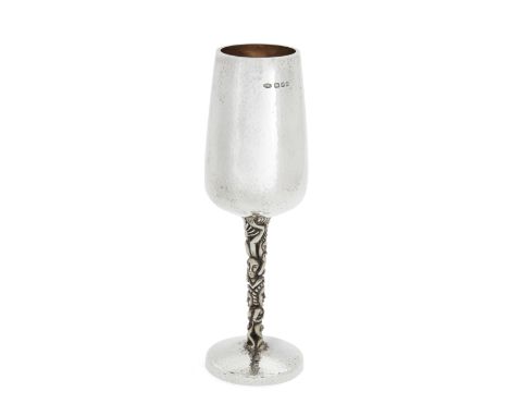 A parcel gilt silver wine goblet Stuart DevlinLondon, 1975The planished body and foot to a stylised figural stem reminiscent 