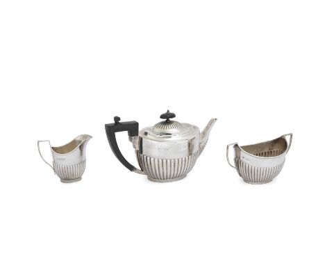 A Victorian three piece silver tea setWilliam Hutton & SonsLondon, 1897Comprising teapot, cream jug and twin handled sugar bo