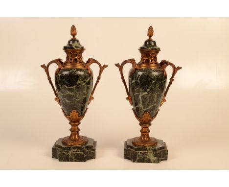 A pair of ormolu mounted marble cassolettes in Louis XV manner circa 1900, each with domed covers surmounted by an acorn fini