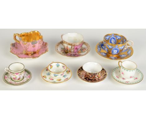 Seven miniature cups and saucers, including Coalport, Royal Crown Derby, Dresden, Wedgwood and Mintons.   Condition report:  