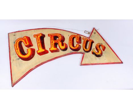 A painted 'Circus' sign, in the form of an arrow, height 66.5cm, width 123cm.
