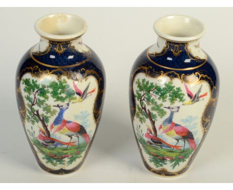 A pair of Worcester style porcelain scale blue ground baluster vases, decorated with exotic birds within gilt cartouches, hei