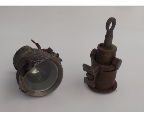 A Powell & Hanmer metal gas lamp and a boat speedometer.