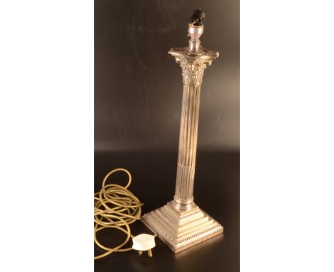 A tall Corinthian column silver table lamp by Walker & Hall, Sheffield 1911, height 47cm. excluding nozzle.