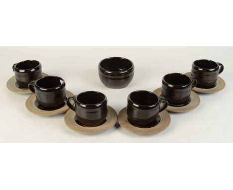 Six Scott Marshall, Boscean Pottery cups and saucers, with part tenmoku glaze and a matching small bowl. 