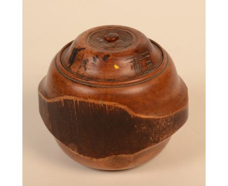 A Japanese wooden tea caddy, Meiji period, the cover carved with character marks, height 11.5cm.