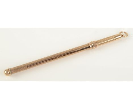 A 9ct gold engine turned propelling swizzle stick.