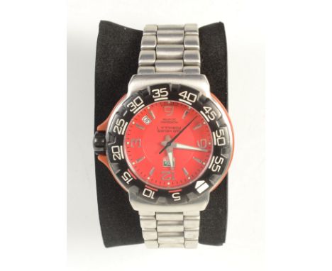 A Tag Heuer Formula 1 Ferrari red gentleman's wristwatch with sweep seconds and calendar aperture between 4 and 5 o'clock, bo