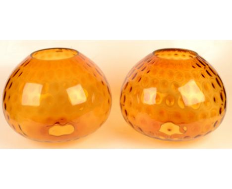 A pair of amber glass lamp shades, diameter 30cm, height 26.5cm.