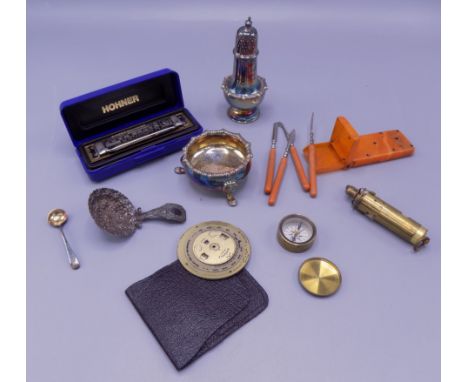 A miniature brass compass, diameter 3cm, a Hohner blues harp mouth organ, silver plate etc. 
