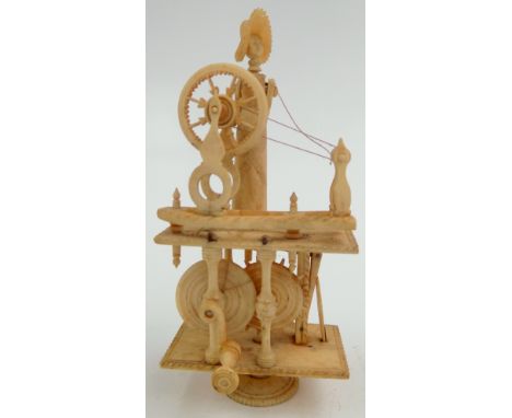 A Napoleonic French prisoner of war carved bone spinning Jenny automaton, early 19th century, the figure standing behind a wh