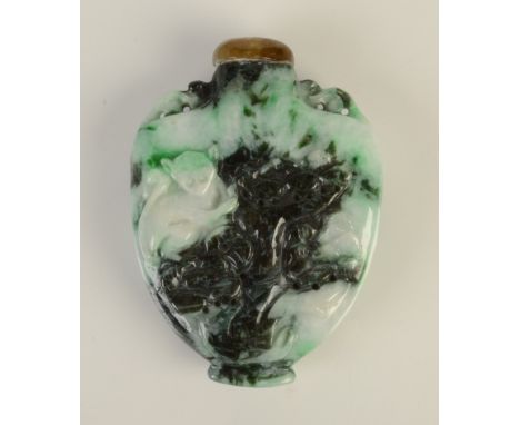A carved jade snuff bottle, 1890/1900, height 5.8cm. 