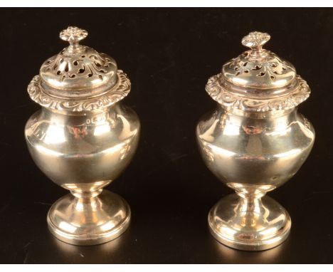 A pair of William IV vase shape condiments each with pierced lid and fruit finial, one named salt to the shoulder the other p