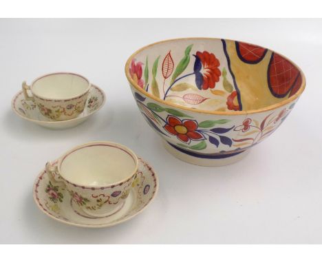 A creamware hand painted bowl, 19th century, height 12cm, diameter 24.5cm and a pair of cups and saucers.