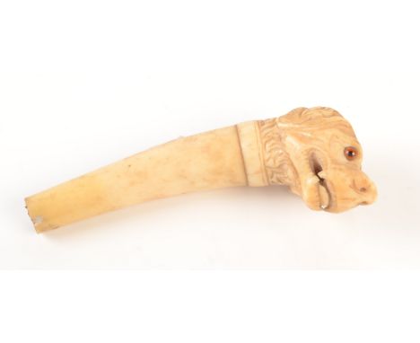 An ivory walking stick handle, 19th century, carved in the form of a dog's head, length 12.5cm