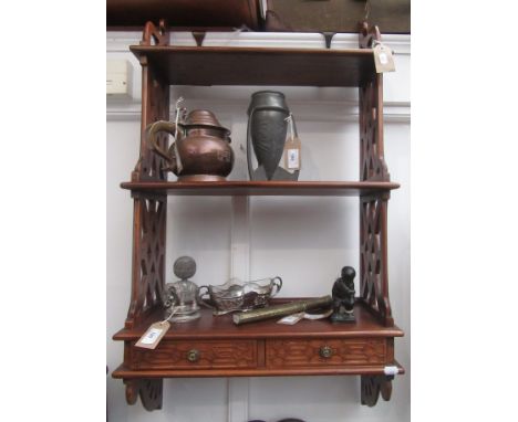 A pair of Chinese Chippendale mahogany hanging shelves, each with three shelves flanked by pierced sides, above two drawers, 