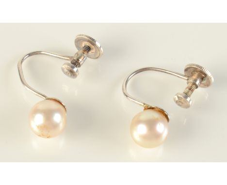 A pair of pearl silver mounted screw in earrings in K Mikimoto Regent Street box.